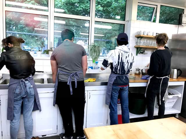 Students chip in with the washing up.