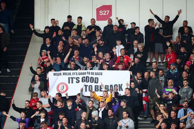 Bristol City fans hold a banner reading Its good to be back during the Sky Bet Championship match between Bristol City and Blackpool at Ashton Gate on August 7, 2021 Photo by Marc Atkins/Getty Images) 