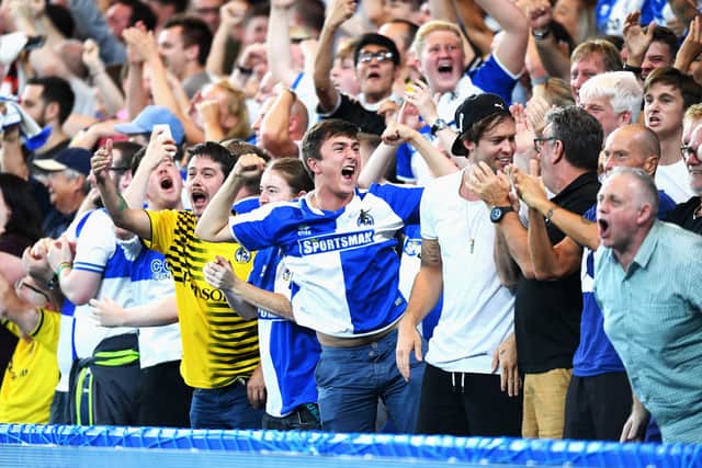 Bristol Rovers fans celebrate the goal scored by Peter Hartley during the EFL Cup second round match between Chelsea and Bristol Rovers at Stamford Bridge on August 23, 2016 in London, England.  (Photo by Michael Regan/Getty Images )