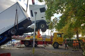 Fire services haul a lorry out of the water after it fell into Bristol harbour this week.