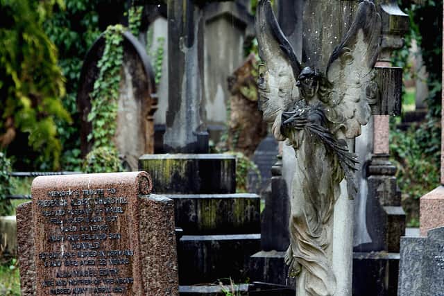   Rain drops fall onto a grave in Arnos Vale cemetery in Bristol.