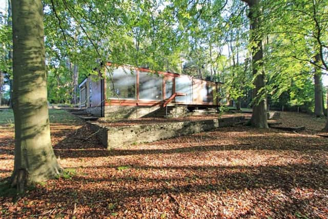 The property benefits from panoramic windows which look out over the woods.
