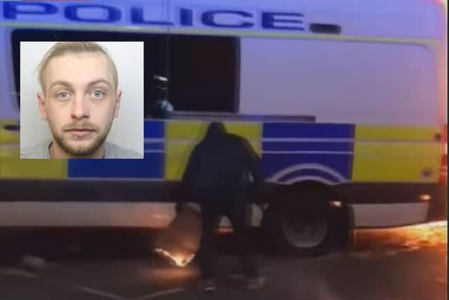 News footage from the night showed Roberts holding a piece of burning cardboard under a police van as it reversed. Seven officers were inside the vehicle at the time.