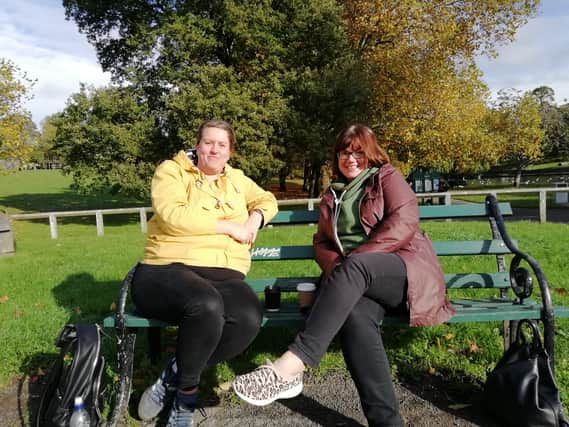 Lydia Herbert and Jo Deasey discuss Covid rates in their area while on their weekly catch-up at St George Park