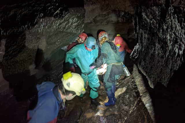 Volunteers assisting in the cave rescue