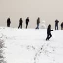 Office workers host a impromptu snow ball fight outside their offices close to the Severn Bridge which has been closed due to adverse weather on January 13, 2010 near Bristol, England. 