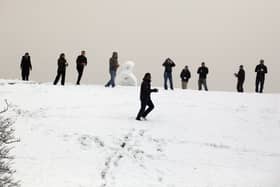 Office workers host a impromptu snow ball fight outside their offices close to the Severn Bridge which has been closed due to adverse weather on January 13, 2010 near Bristol, England. 