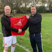 Steve Weyman is gifted a jumpband Laurence Honeyfield at Greville Symth playing football
