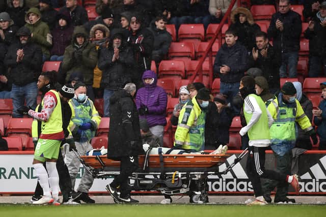 Nathan Baker suffered a nasty injury against Sheffield United on Sunday. (Photo by Nathan Stirk/Getty Images)
