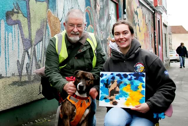 Banksy the dog next the cat and dog mural in Easton - and his own version