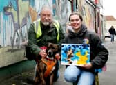 Banksy the dog next the cat and dog mural in Easton - and his own version