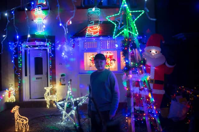 Jake Skinner in front of the festive light display in honour of sister who died on Christmas Day