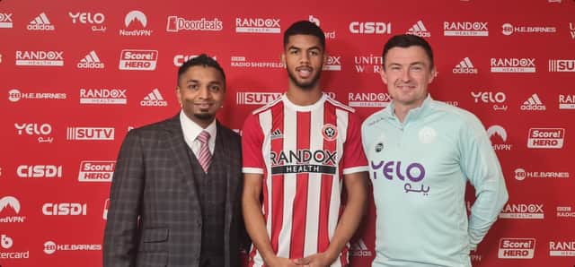 Miguel Freckleton (centre) with his agent Arfan Rehman and Sheffield United manager Paul Heckingbottom