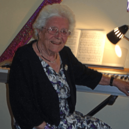 Rita Hookway on her 90th birthday. She was a church organist and pianist who ‘filled the house with music’ was Jane was a child.