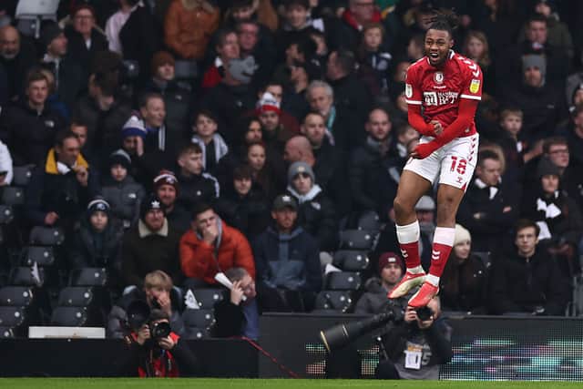 Antoine Semenyo jumps high as he celebrates scoring against Fulham.