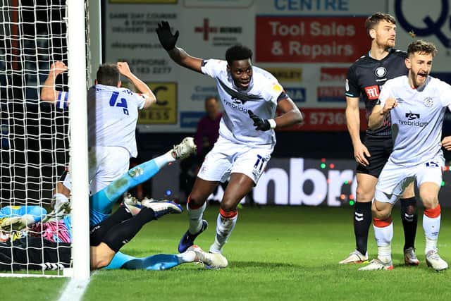 Elijah Adebayo of Luton Town celebrates after scoring their second goal.