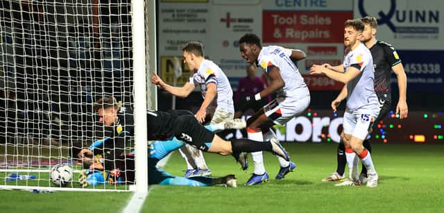 Elijah Adebayo (C) of Luton Town scores their second goal.
