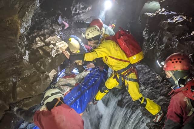Volunteers assist in the cave rescue. 300 volunteers were deployed in total.