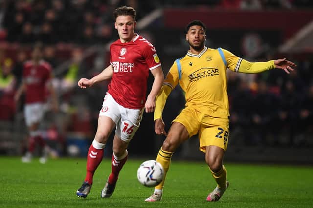 Cameron Pring of Bristol City battles for possession with Josh Laurent of Reading.