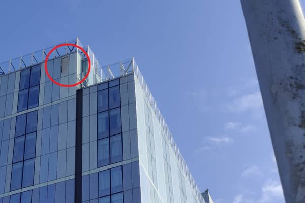 Glass can be seen missing from the top of Radisson Blu hotel in Bristol following storm damage