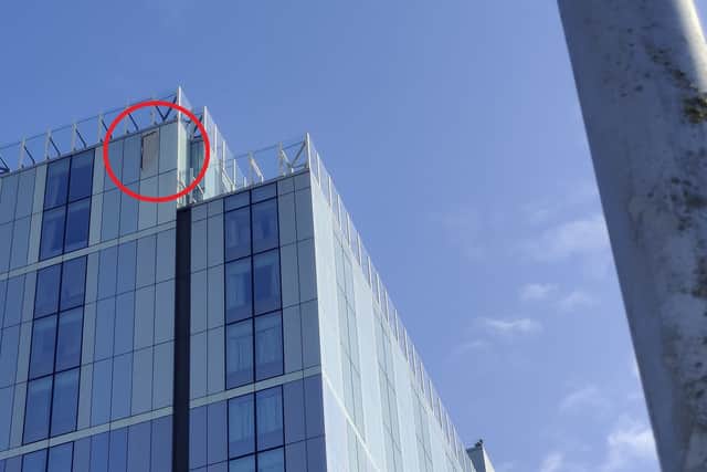 Damage (circled) to the top of Radisson Blu hotel in Bristol city centre