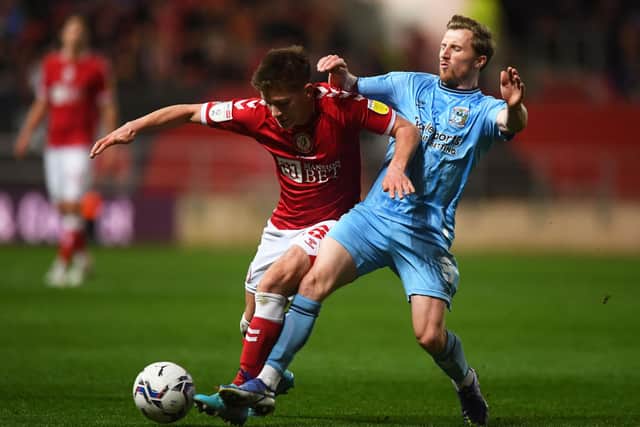 Ayman Benarous of Bristol City is tackled by Jamie Allen of Coventry City.