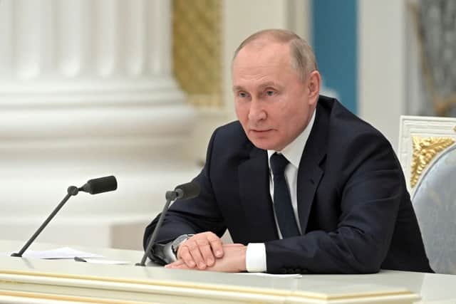 Russian President Vladimir Putin chairs a meeting of big businesses at the Kremlin in Moscow on February 24.