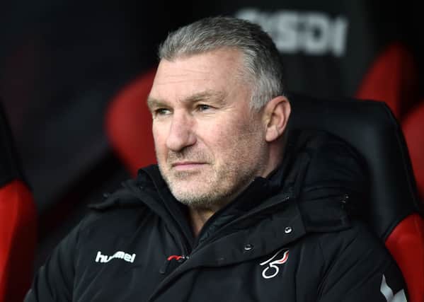 Nigel Pearson, manager of Bristol City looks on.