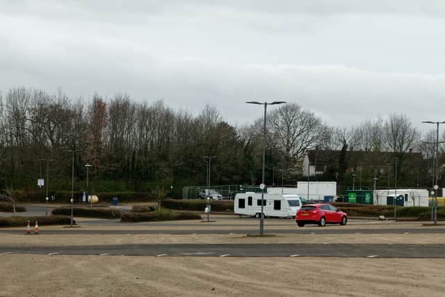 Cars parked at the park and ride kept away from the caravans