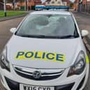 The smashed windscreen of the police patrol vehicle in Knowle