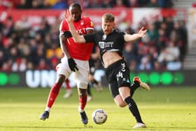 Cundy battles for possession during Nottingham Forest fixture. 