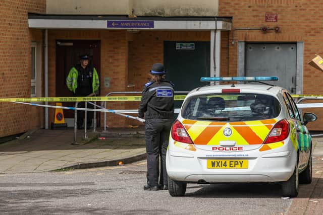 A man has been arrested after a woman died when she fell from a block of flats in Easton