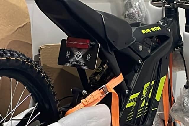 A teenager was assaulted and robbed of the black SUR-RON electric motorbike (pictured)