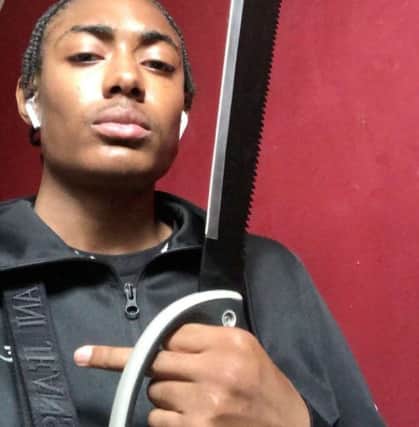 Detectives found a picture of Sawyers posing with a knife on social media.