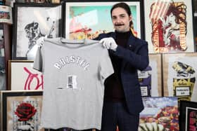 A T-shirt belonging to one of the Colston 4 is to go up for auction at East Bristol Auctions - pictured is Jay Goodman-Browne from the auction house