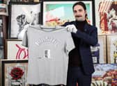 A T-shirt belonging to one of the Colston 4 is to go up for auction at East Bristol Auctions - pictured is Jay Goodman-Browne from the auction house