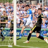 Aaron Collins of Bristol Rovers scores their side's sixth goal.
