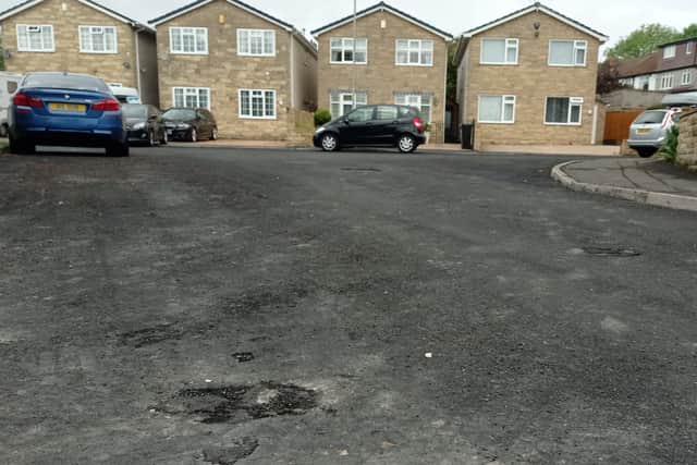 Damage to the road in High Elm Kingswood after it was resurfaced last month
