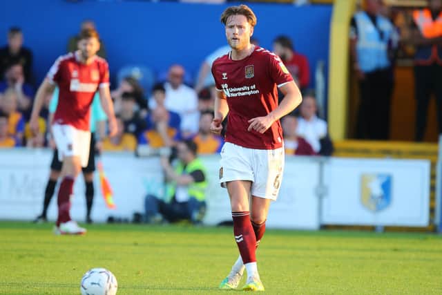 Central defender Fraser Horsfall playing for Northampton Town.