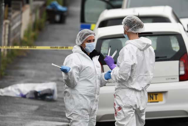 Forensic team in Bloomfield Road yesterday