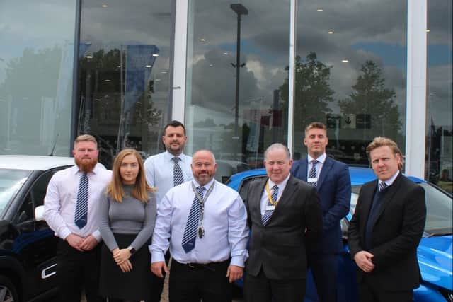 Some of the team at City Motors - which says its future business plans are under threat due to housing plans for its site