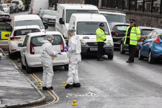Police and forensic teams pictured on Bloomfield Road shortly after the incident.