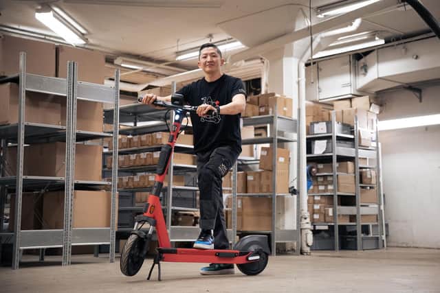 Warehouse mechanic with a Voiager 5 (V5) e-scooter