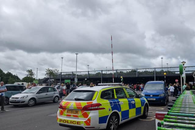 The scene outside Asda in Longwell Green after the store was evacuated this morning