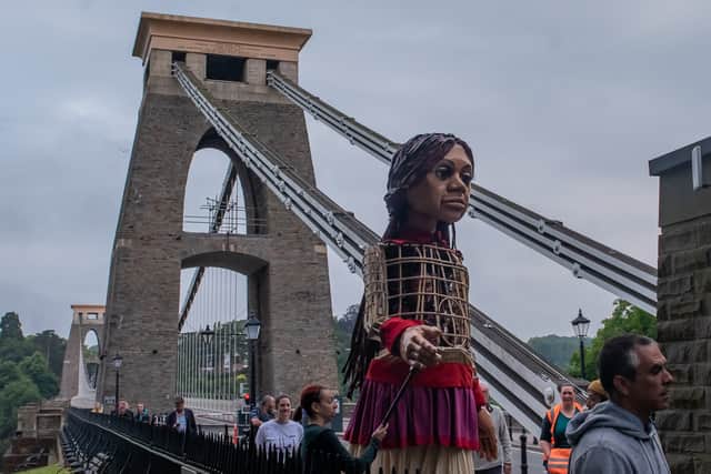 The giant puppet of a Syrian refugee has walked nearly 5,000 miles across Europe so far, raising awareness of the urgent needs of young refugees.