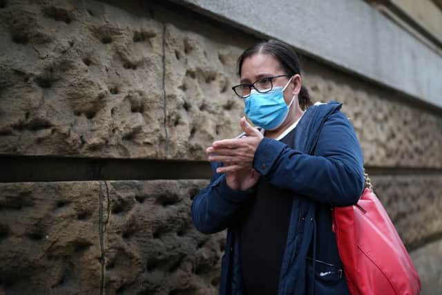 A member of the public wears a pandemic face mask ahead  (Photo by Christopher Furlong/Getty Images)