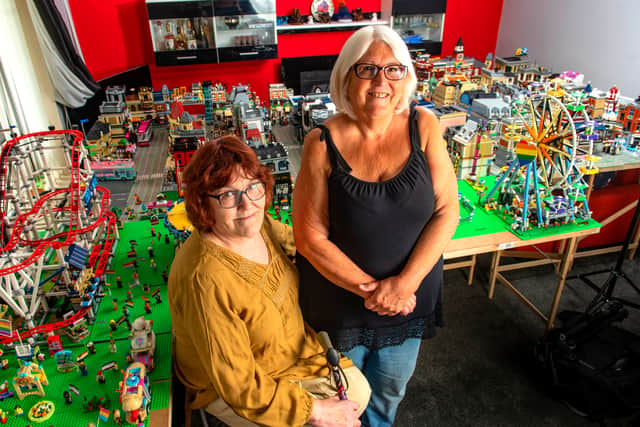 Karen with her carer Kay, one of three carers who helped her construct Lego Pride.