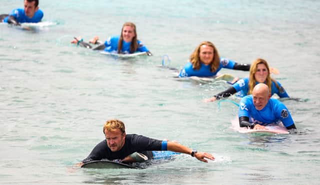 Nick Hounsfield leads out surfers at The Wave.