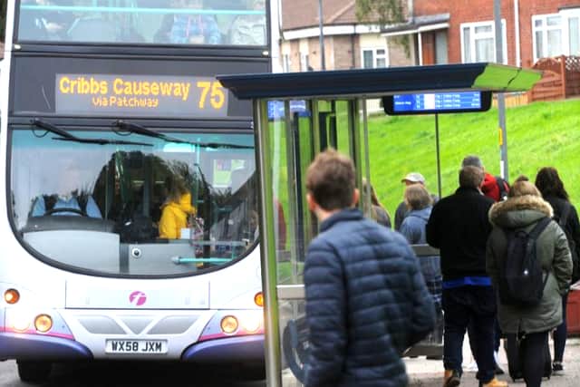 Passengers wait for a First Bus to Cribbs Causeway.