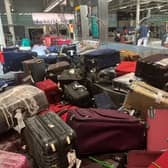 Suitcases are seen uncollected at Heathrow’s Terminal Three baggage reclaim